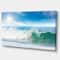 Designart - White and Blue Waves under Sun - Seascape Canvas Art Print